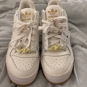 Adidas White Sneakers with Gold Accents